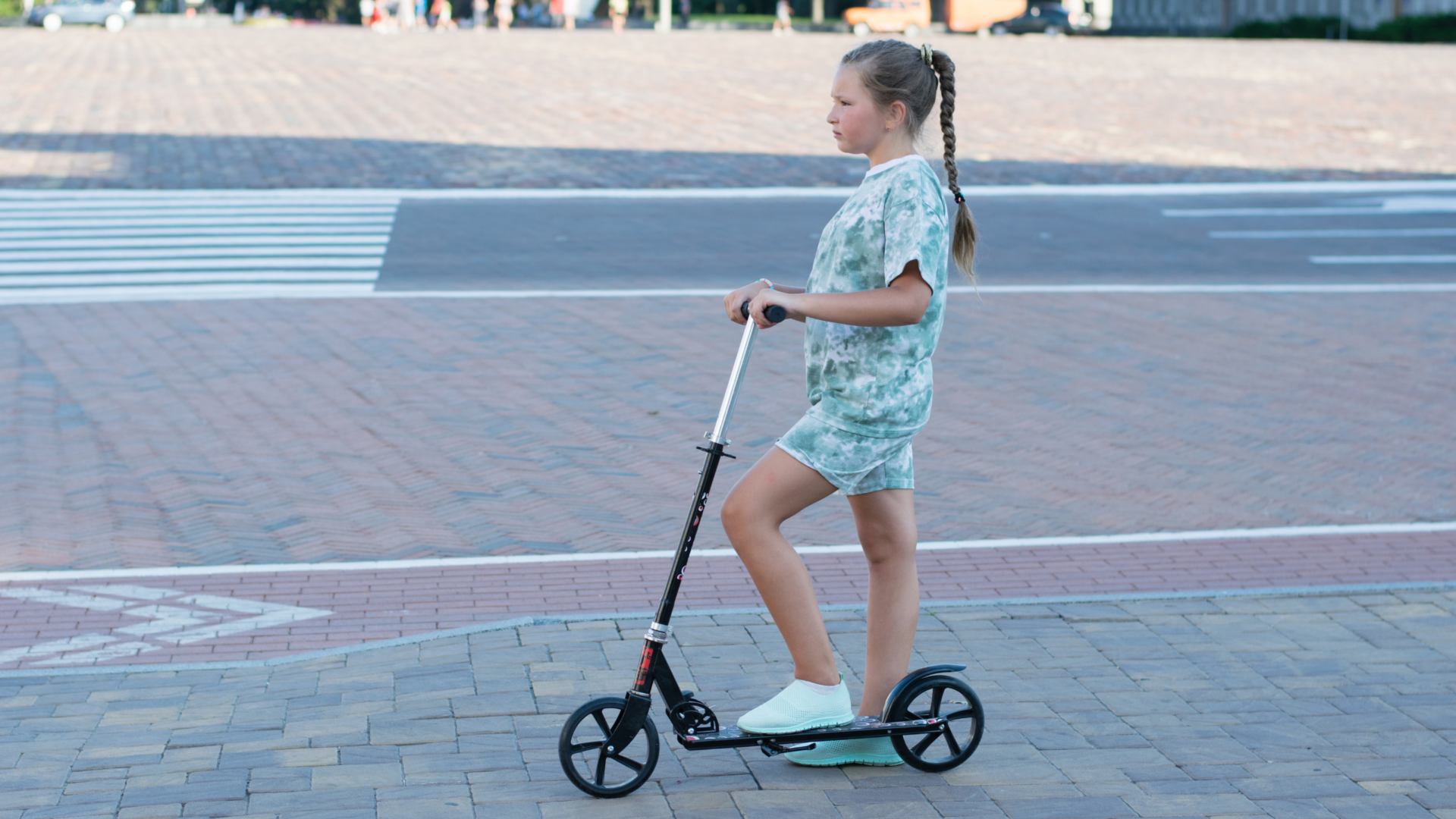 Female kid riding on a electric scooters for 13 year olds