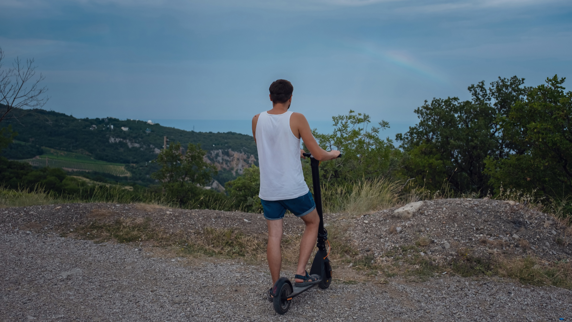 Man with best electric scooters for hills.