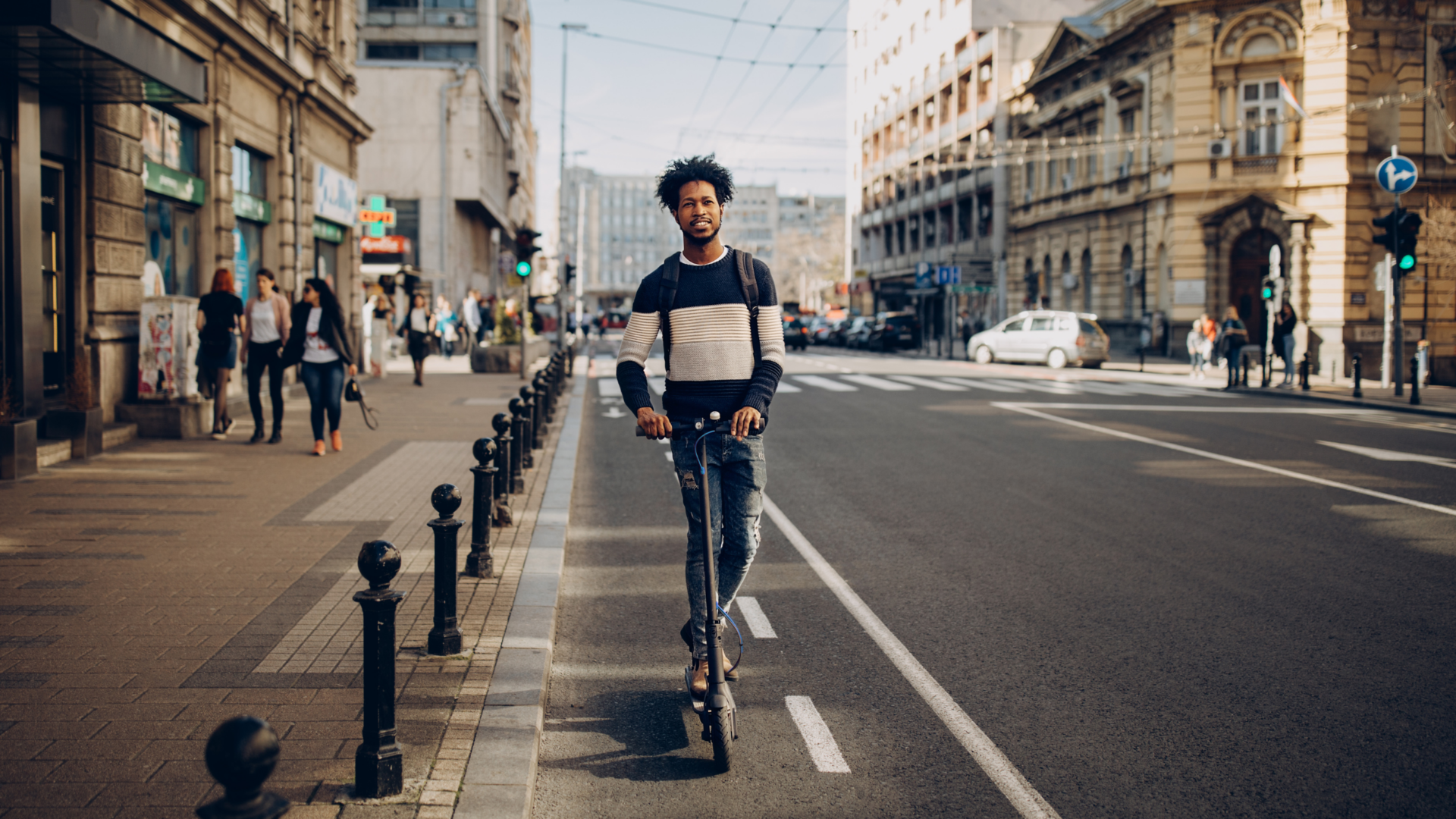 boy driving electric scooter down city bike lane do electric scooters require a license