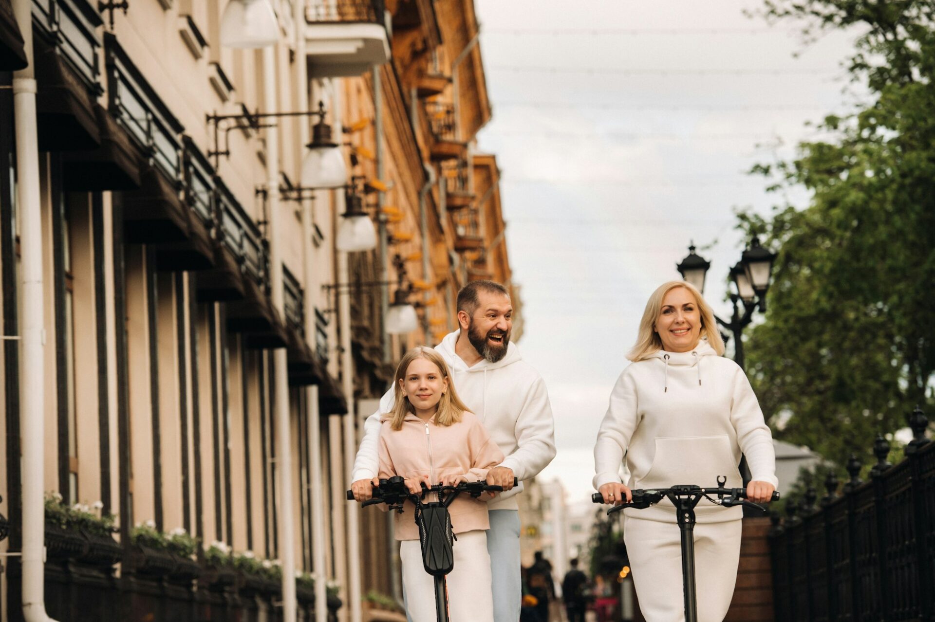 A family riding electric scooters.