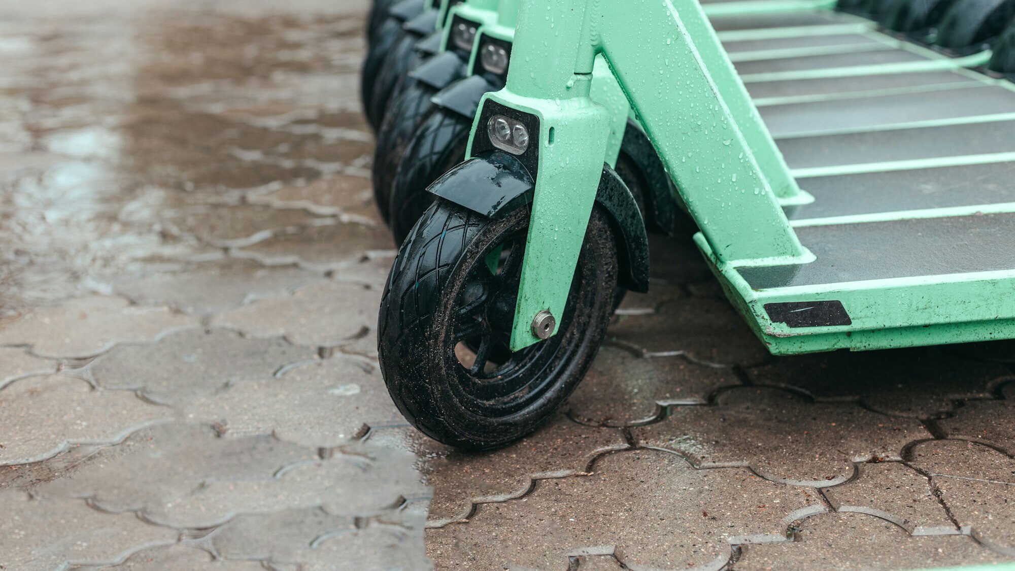 electric scooters sitting outside in rain, are electric scooters waterproof
