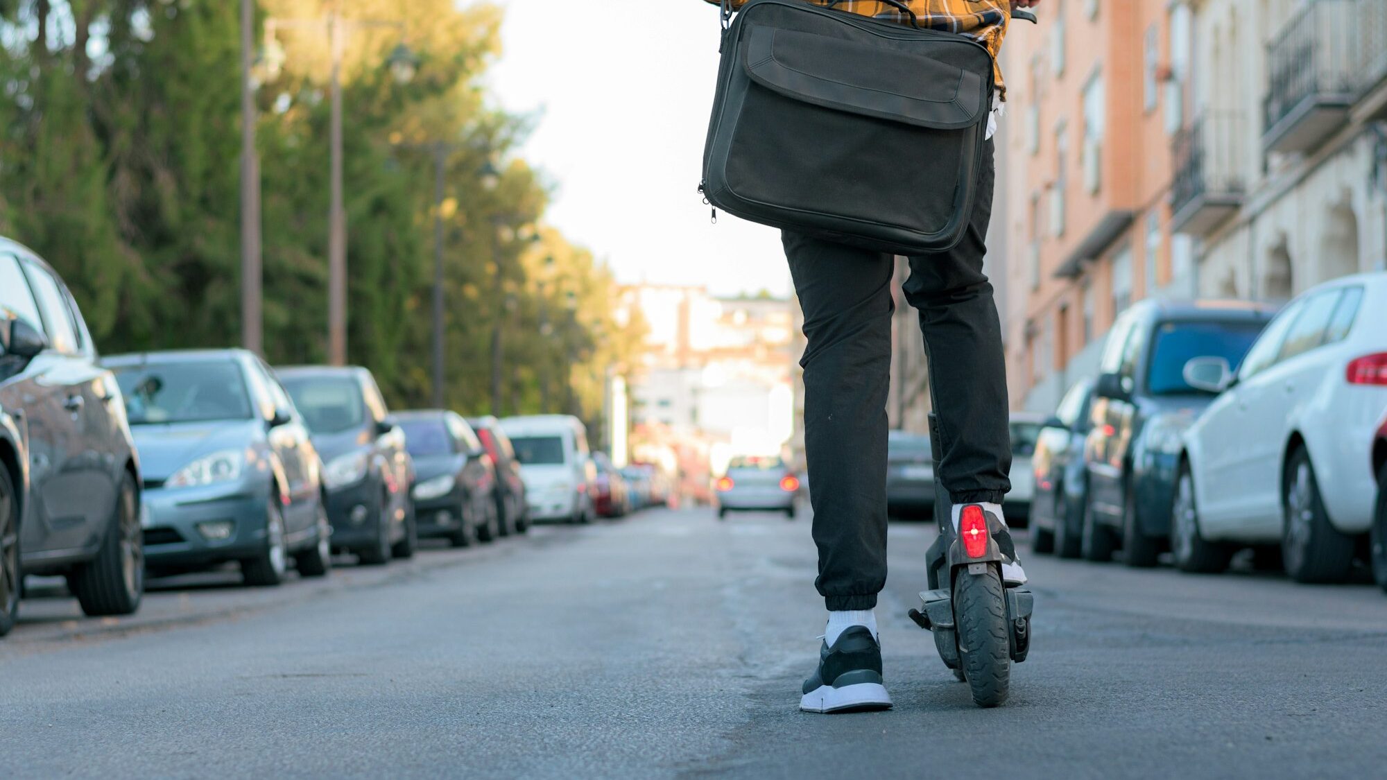 Unrecognizable man on an electric scooter