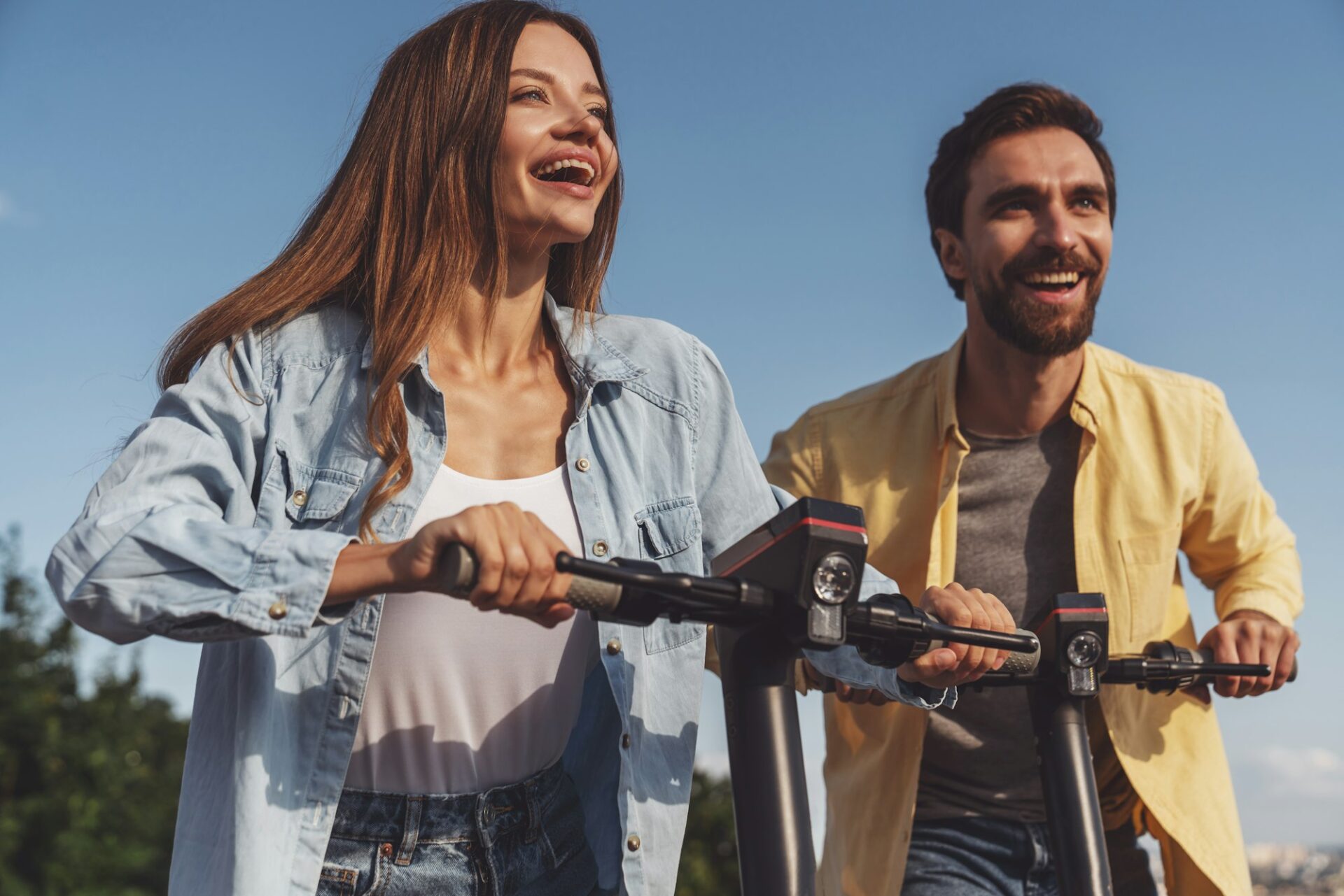 Couple riding on electric scooters