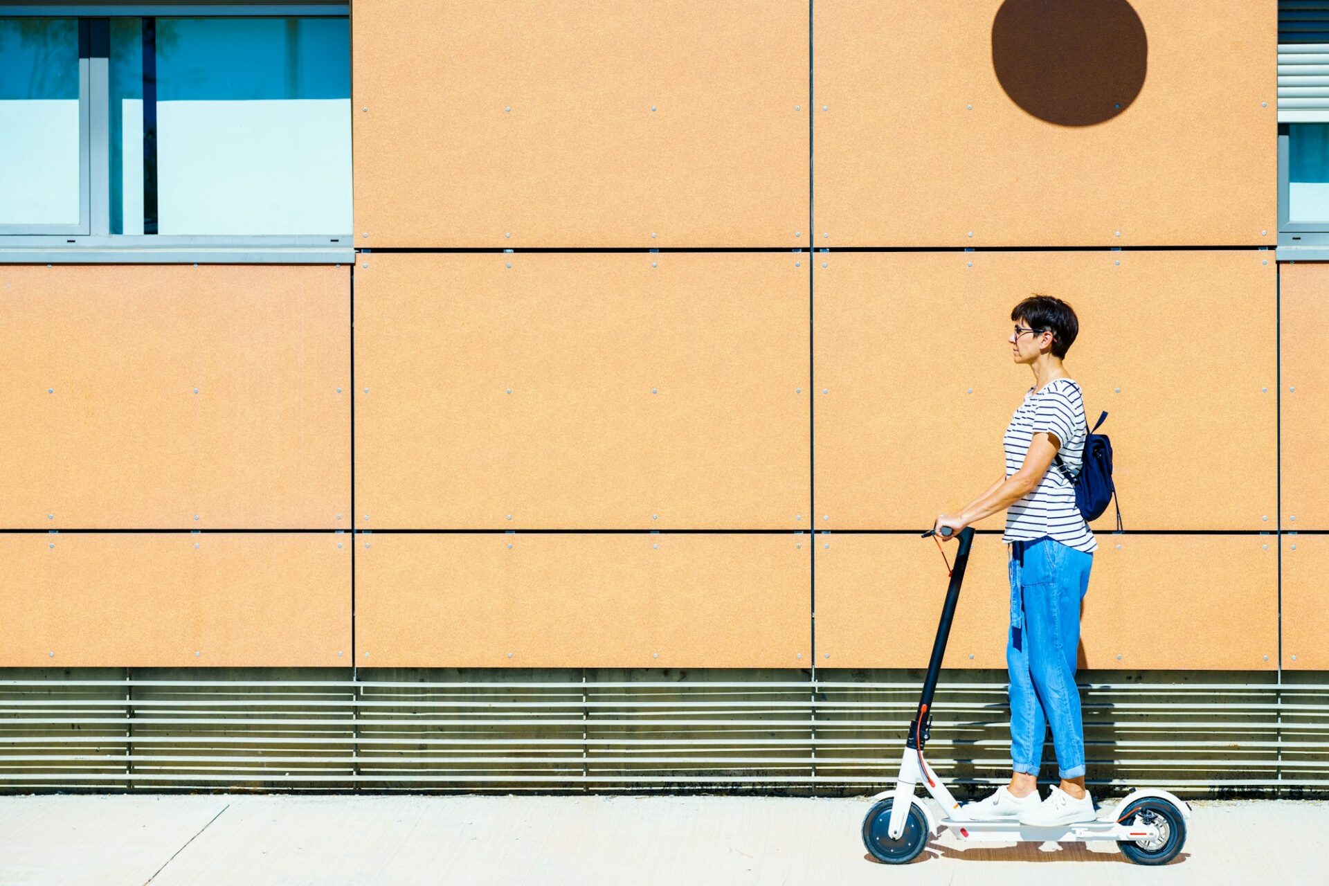Woman riding on an electric scooter.
